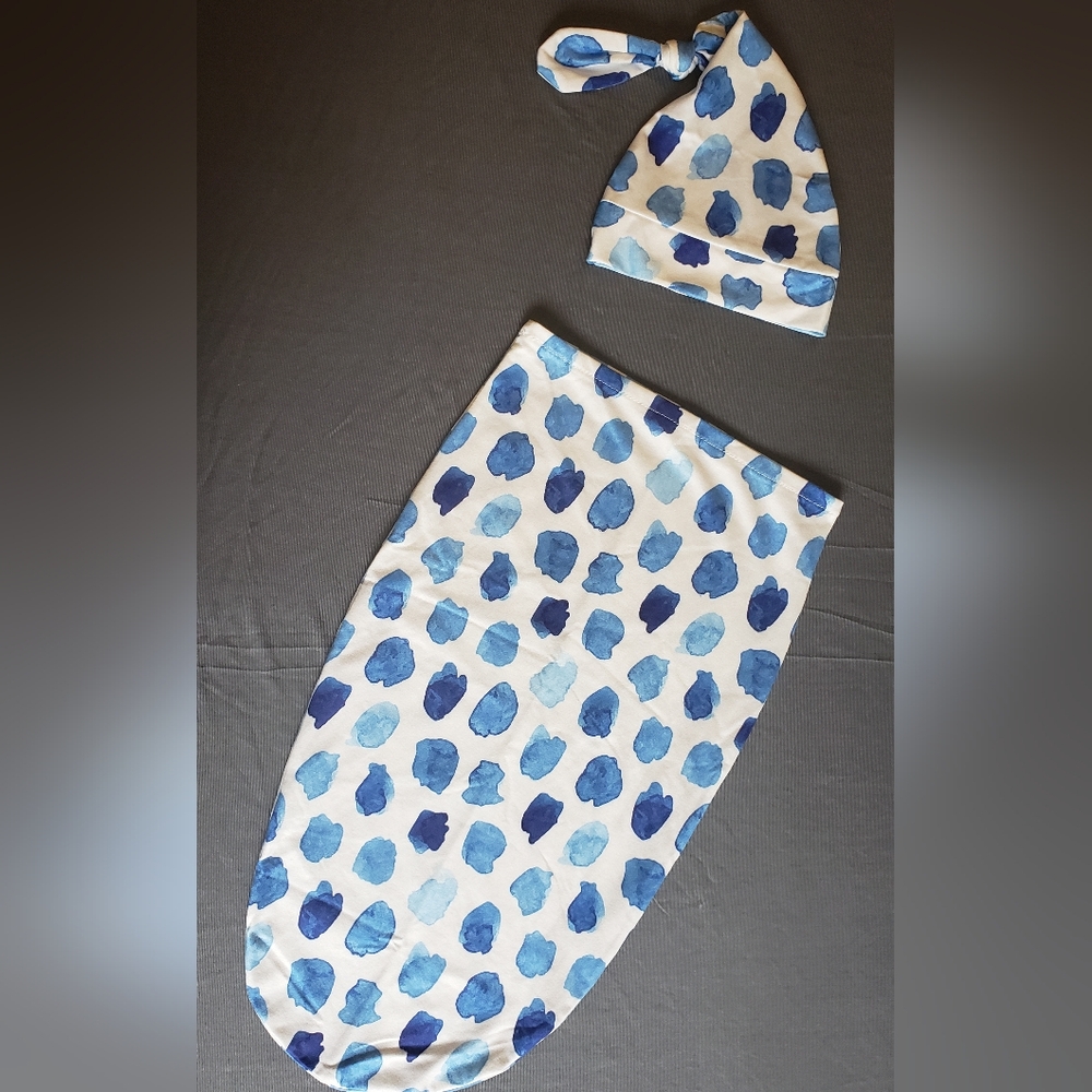 Newborn swaddle with hat.